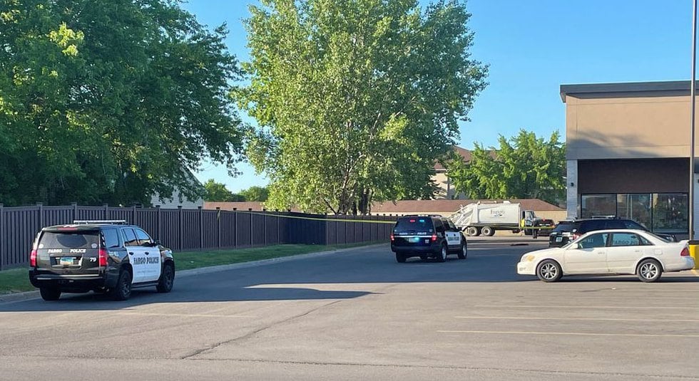 Caution tape blocks off a portion of the Party City parking lot just off of 13th avenue in Fargo.
