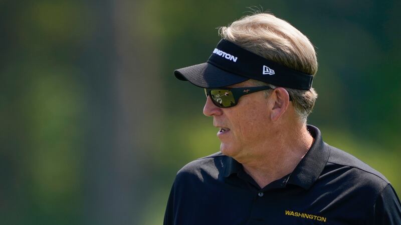 FILE - Washington Football Team's defensive coordinator Jack Del Rio looks over the field...