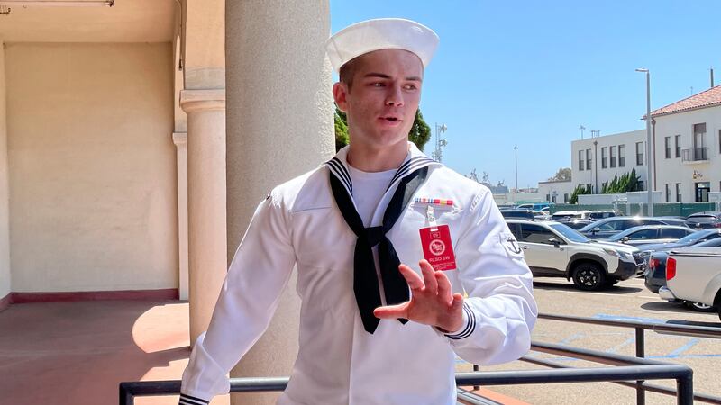 FILE - US Navy sailor Ryan Sawyer Mays walks past reporters at Naval Base San Diego before...